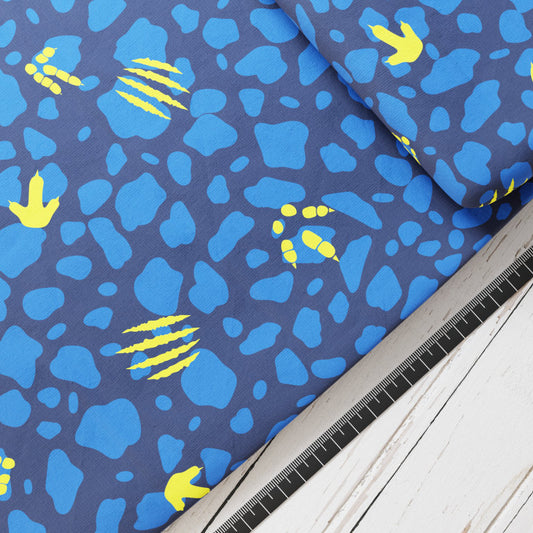 Baumwollsatin: Dino Spuren - perfekt für Schultüten, Accessoires zur Einschulung - Tyrannosaurus, T-Rex, Dinosaurier, Blau, Gelb